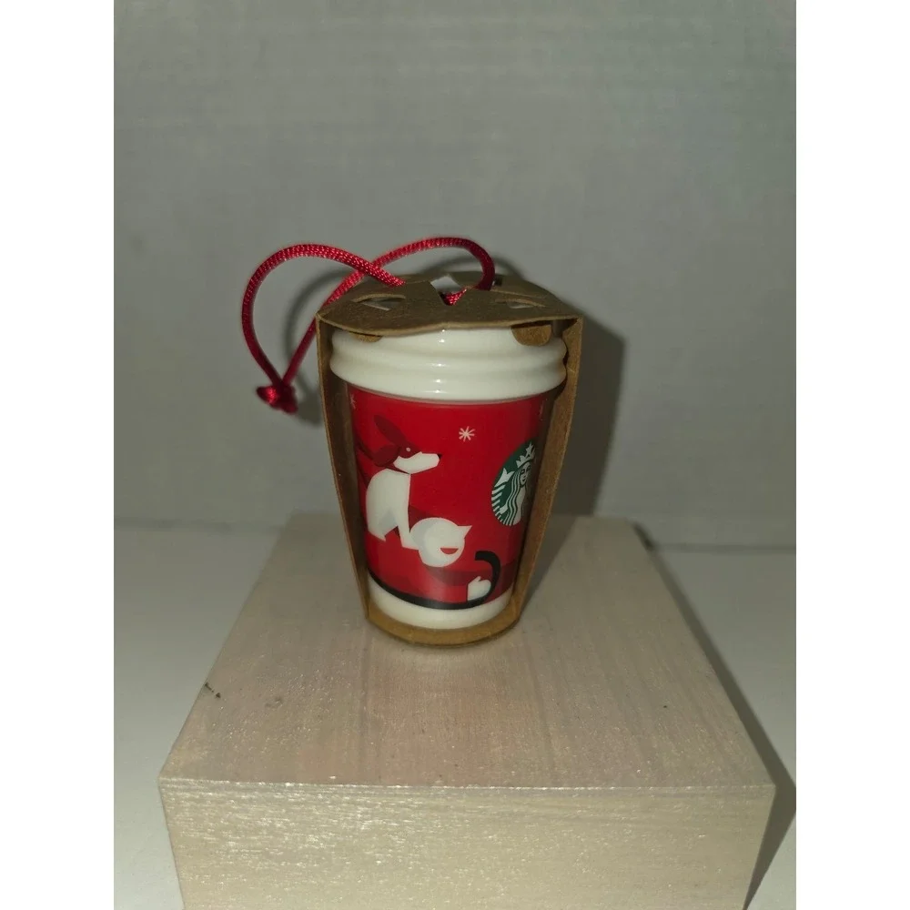 2011 Starbucks Ceramic Holiday To-Go Cup ornament dog and‎ boy on a sled